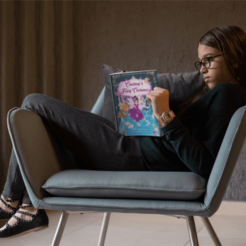 kid-reading-a-book-mockup-sitting-on-a-vintage-armchair-a19075-min-min kid-reading-a-book-mockup-sitting-on-a-vintage-armchair-a19075-min-min