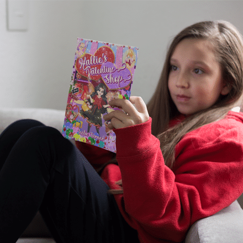 little-girl-reading-a-book-mockup-on-an-armchair-a19093